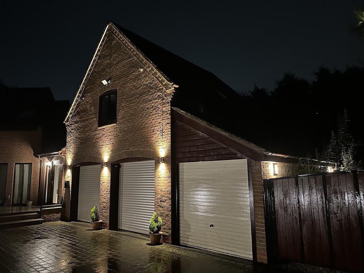 Exterior of a home with facade and security lighting at night